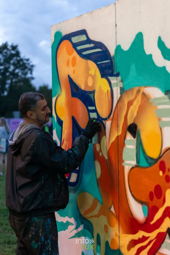 Graffeur au travail a l Urban Village des Solidarites 2026