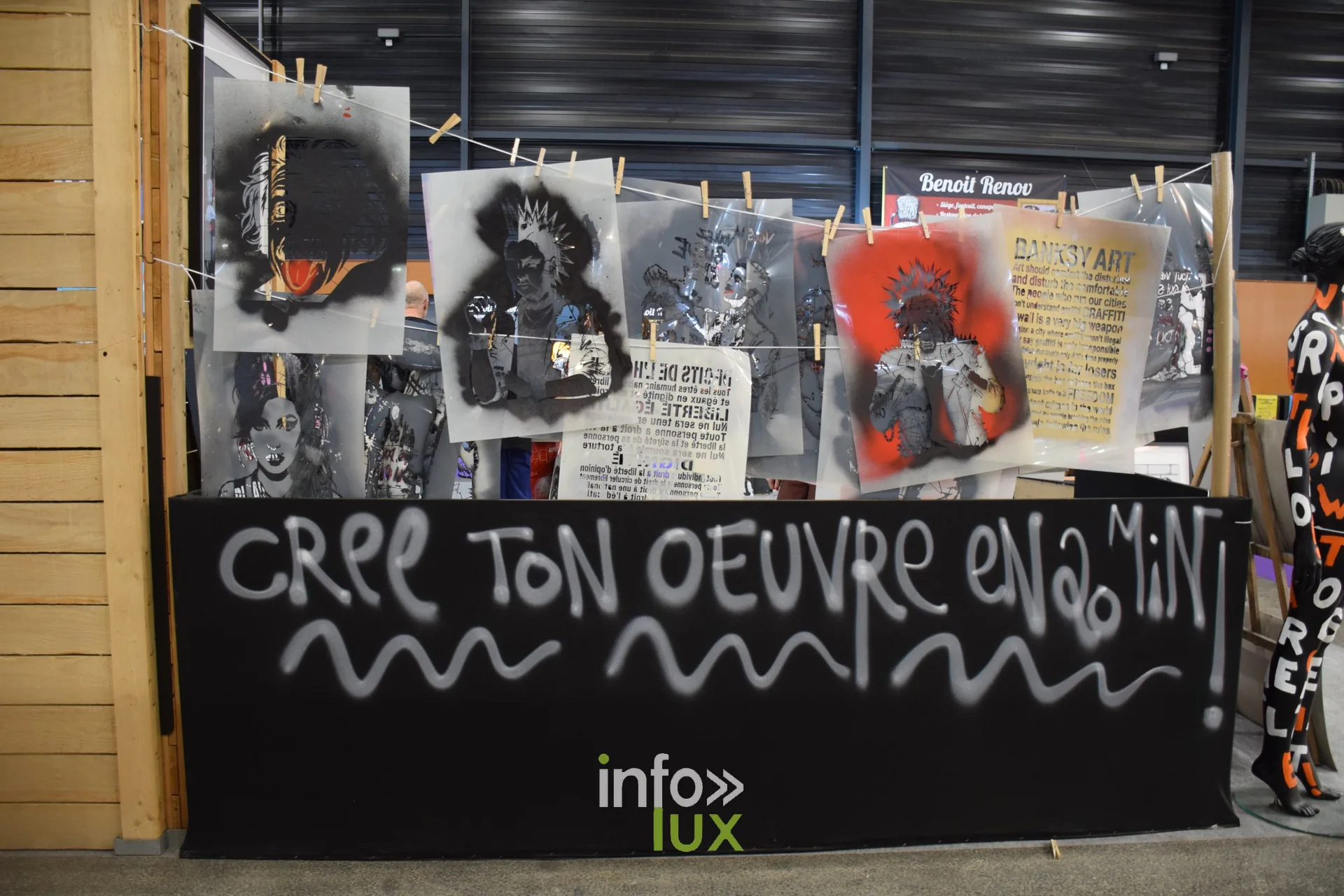 Mur « Crée ton œuvre en 20 min » couvert d’affiches, Foire internationale de Metz 2026