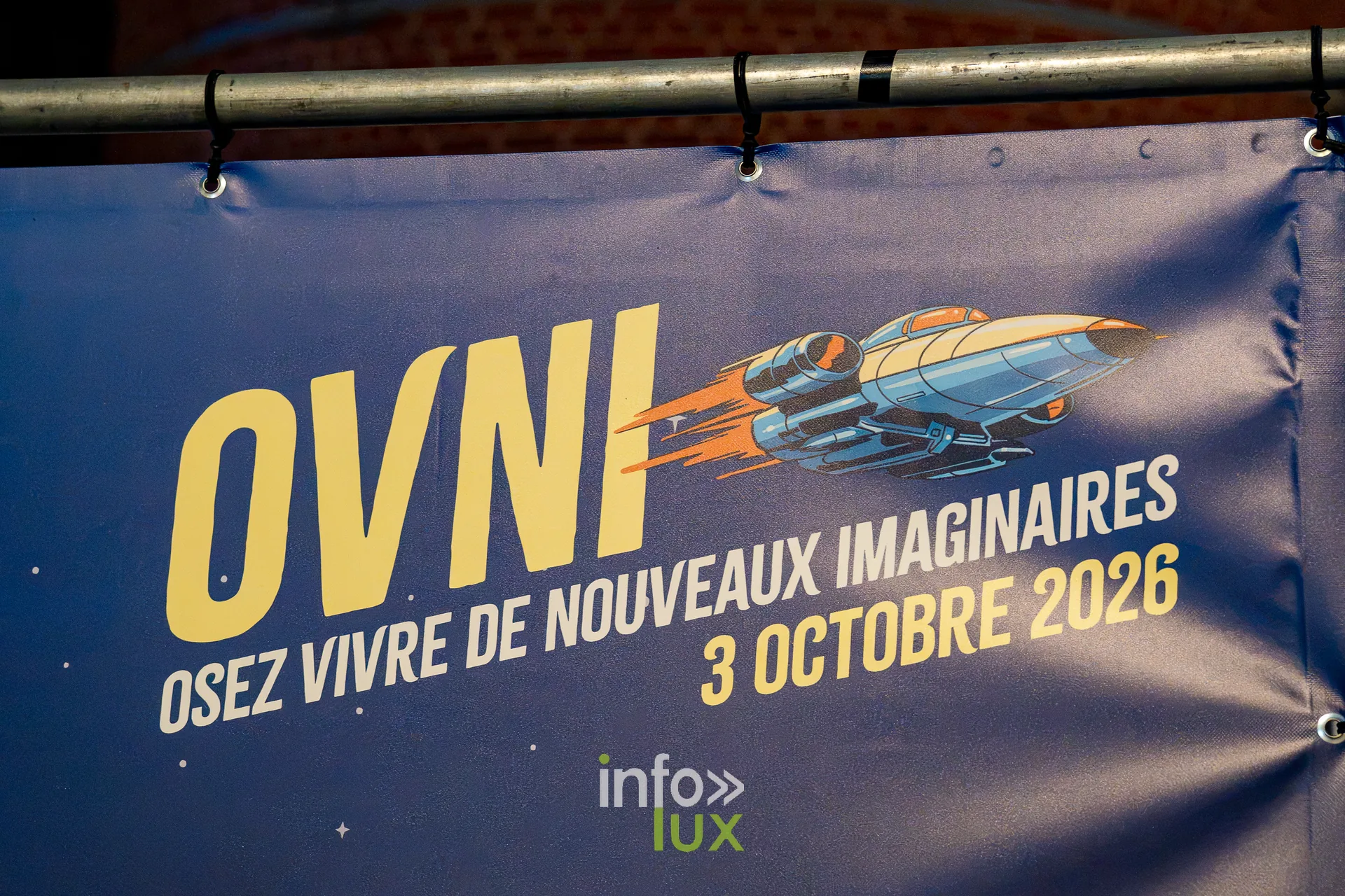 Nuit de la Culture 2026 à Esch-Belval : bâche « OVNI, osez vivre de nouveaux imaginaires, 3 octobre 2026 »